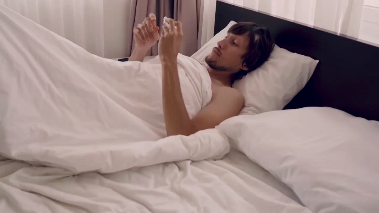 Load video: Man wearing a custom dental nightguard before sleep — real use demonstration
