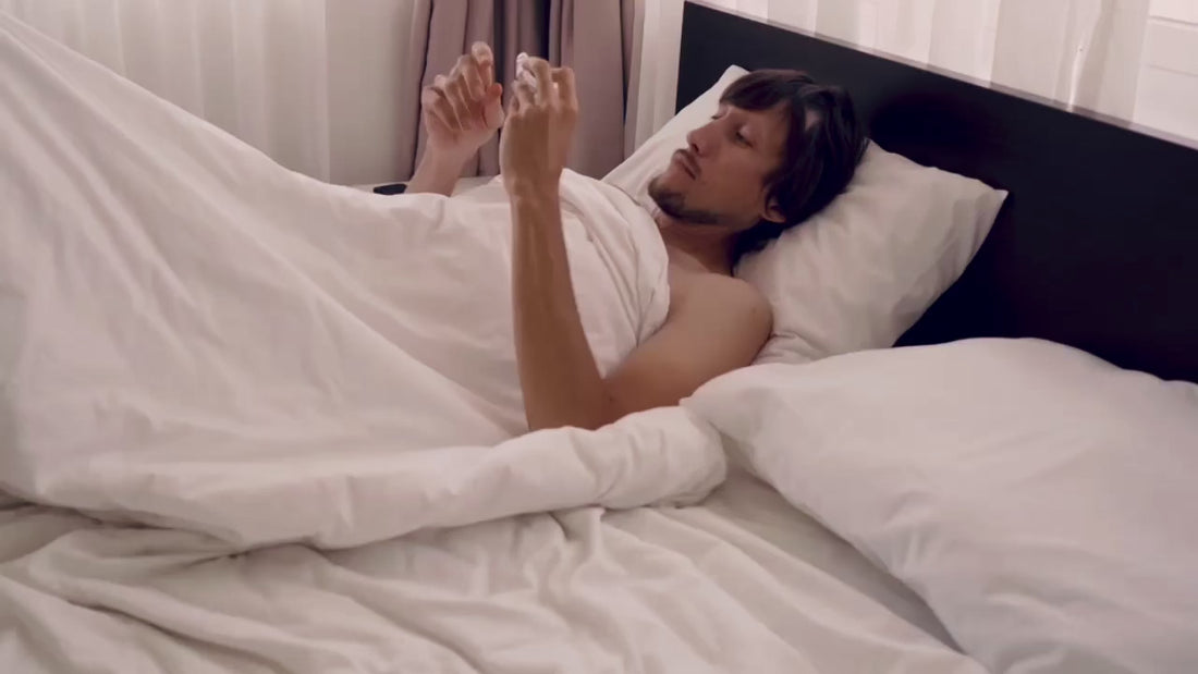 Man wearing a custom dental nightguard before sleep — real use demonstration