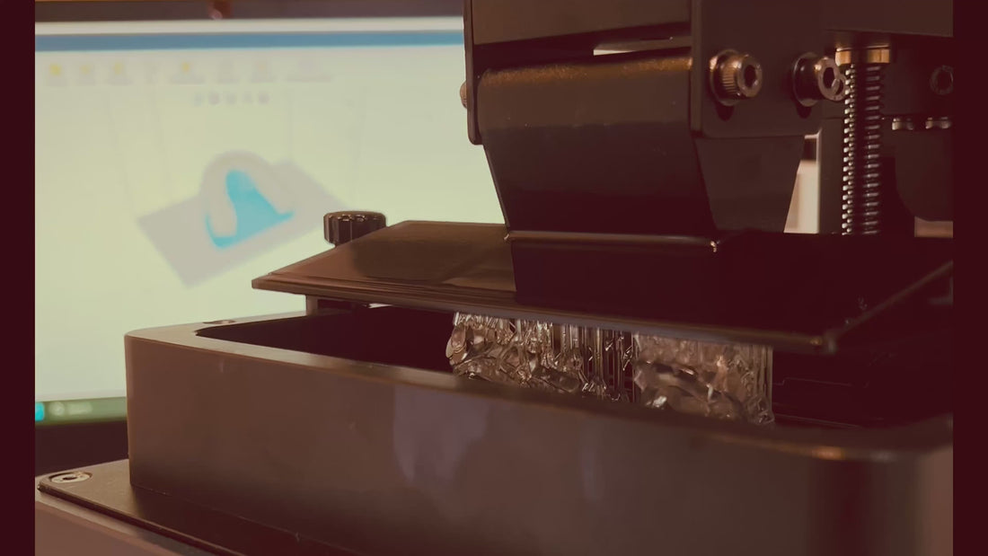 Real-time footage of a custom dental night guard being 3D printed with medical-grade resin and CAD precision.